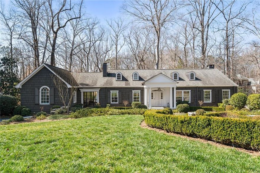 Situated in the heart of Buckhead, this au courant home impresses with an incredible renovation by Stan Dixon. Enjoy the outdoors on the expansive rear deck, which leads to a grassy play area and beyond to the heated and saltwater pool and cabana. Continue into the stunning kitchen where a large island offers seating, refrigerator/freezer drawer and an abundance of prep space. Additional details include white cabinetry, marble countertops, a Sub-Zero refrigerator/freezer, a Sharp microwave drawer and three large windows flooding this space with natural light. Relax and unwind in the peaceful owner's suite with a wall of French doors that open to the back deck. The en suite bathroom features a barrel-vaulted hallway w/ dual walk-in closets, heated floors, double sinks, a soaking bathtub & a separate shower. A convenient bedroom suite is located on the main level. Venture upstairs to discover a well-designed landing area maximizing the usable space and outfitted with two built-in desks, bookcases and cabinet storage. Two add'l bedrooms, each w/ walk-in closets, and a bathroom with a glass shower complete the upper level. The living spaces continue on the terrace level, which offers an abundance of daylight-filled rooms including a laundry room, a gym, a full pool bathroom and a sprawling rec room with French doors to the backyard. Add'l details include extensive stone walls, a two-car stone garage with space below that is already stubbed with electrical and plumbing lines for a guest house, a parking pad & a level front yard. Located in the award-winning Morris Brandon Elementary School district, this inviting home offers proximity to I-75, I-85, Buckhead, Midtown and the perks of Buckhead living. Matterport and video tours available upon request.