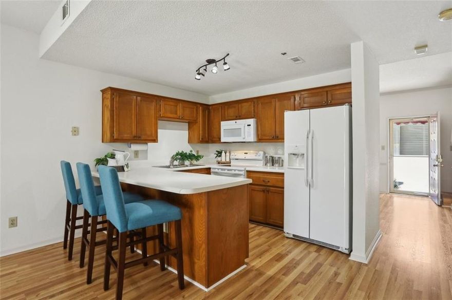 Welcome to your urban oasis in the heart of Alpharetta! This is your opportunity to get into a turnkey Townhouse style Condo in Milton High School under $300k! This 2 bedroom, 2.5 bathroom condo offers the perfect blend of modern sophistication and comfort. Minutes to all that Downtown Alpharetta has to offer and walking distance to Wills Park, this residence provides unparalleled access to Alpharetta's charming city life.

Step inside and be greeted by an open-concept living space. The living and dining areas seamlessly flow together, creating an ideal setting for entertaining guests or enjoying cozy nights in by the fireplace. Enjoy morning coffee on the gated back deck. Don't need a formal dining space? It also makes the perfect office or playroom. There is no carpet in this unit!
The upstairs bedrooms offer a roommate style floor plan and the primary suite has a deck conveniently located off of it. 
Don't miss the opportunity to make this exceptional condo your new home in one of the hottest North Atlanta Suburbs. Welcome Home!