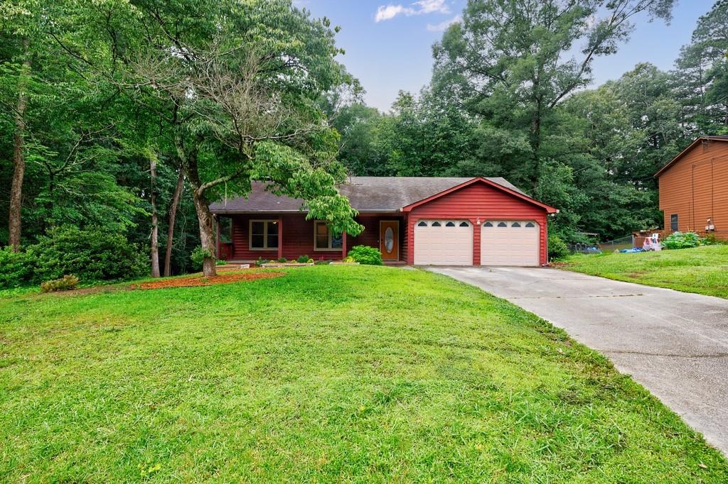 This Stepless Living Ranch is nestled on a Cul-de-Sac with half an acre of serenity. It offers the perfect blend of comfort and convenience being nearby restaurants, groceries, schools, and the highway - making it ideal for families or individuals alike seeking a peaceful yet connected lifestyle. The Welcoming Southern Front Porch sets the tone of relaxation from the front door all the way to the back. As you walk in, the spacious foyer greets you and the large family room provides an abundance of space! There is room for multiple entertainment zones to accommodate everything from cozy movie nights to lively gatherings with a beautiful fireplace enhancing the ambiance. Wood-like flooring and updated lighting spans throughout the entire house, including all the bedrooms. The kitchen is complete with wood cabinetry, granite countertops, and stainless-steel appliances. Adding to the charm, the kitchen sink offers views into a mini "greenhouse," perfect for cultivating herbs or enjoying a touch of greenery indoors. The thoughtfully designed breakfast area is a delightful space where you can sip your morning coffee while enjoying the beauty of nature just outside your window. The Primary bedroom offers a private retreat along with a Bathroom ensuite. Two generously sized secondary bedrooms provide ample space, whether for family members, guests, or a home office setup. The deck and large backyard are perfectly suited for hosting barbecues, starting a garden, or simply relaxing amidst the tranquility of nature. Offering a half an acre of property and setting on a cul-de-sac this type of Lot further adds to this home’s appeal by ensuring minimal traffic and creating a safe and quiet haven for children and pets alike. With its combination of functional spaces, welcoming environment, and convenience to your everyday life, this Stepless-Living home offers everything needed for a comfortable living experience!