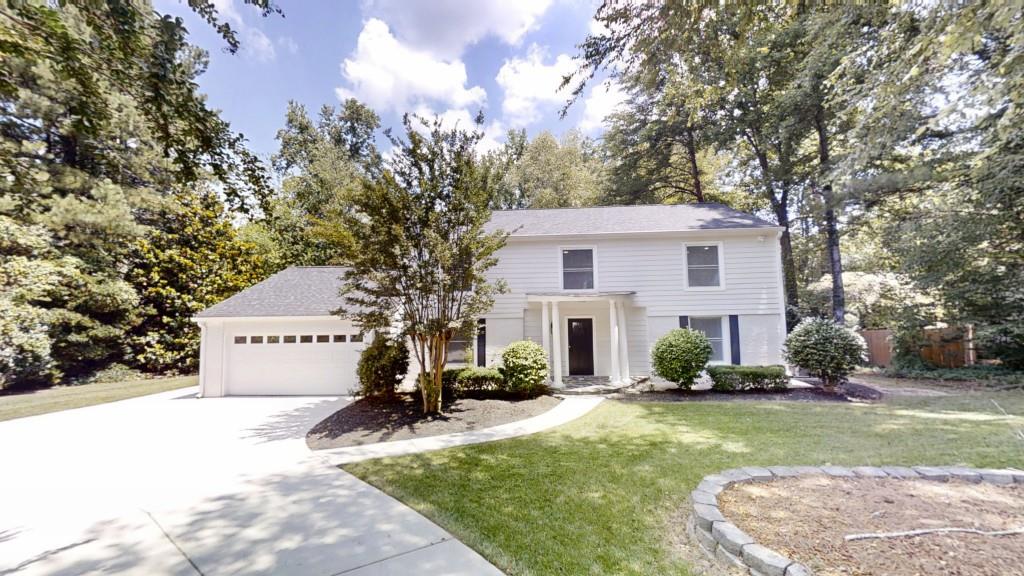 Welcome to this beautifully renovated 4-bedroom, 2.5-bath home in the sought-after Fox Hills neighborhood. Gleaming hardwood floors flow throughout the entire home, with the exception of durable LVP in the hallway leading to the garage, half bath, and laundry room, and classic tile in the upstairs bathrooms. The spacious kitchen is a chef's dream, featuring elegant quartz countertops, stylish white perimeter cabinets, a striking blue island with additional storage, and stainless steel appliances including a built-in wine cooler perfect for entertaining. Retreat to the generous primary suite with a luxurious en-suite bath showcasing a large, beautifully tiled shower. Enjoy morning coffee or evening relaxation on the private rear deck or in the separate screened-in porch, ideal for year-round gatherings. Meticulously landscaped front yard enhances curb appeal, while the home's prime location offers access to top-rated schools and convenient amenities. Don't miss the opportunity to call this exceptional property your home!