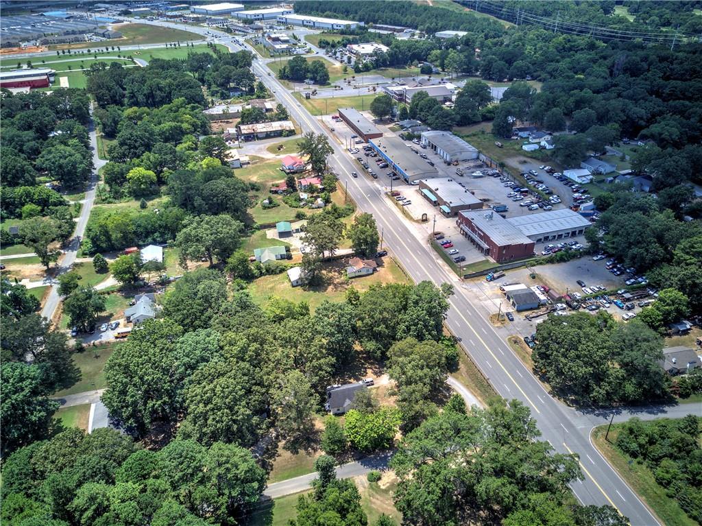 Prime commercial land located directly on Highway 411 with high visibility and heavy passing traffic, ideal for a wide range of business opportunities. Zoned commercial this prime 0.80-acre lot is located just 1.4 miles from I-75 Exit 290 in Cartersville, GA. This highly visible property sits along Highway 411 and is ideally positioned near major attractions including the Tellus Science Museum, Savoy Automobile Museum, and within minutes from LakePoint Sports Complex. Surrounded by established businesses and offering excellent access to I-75, this site is well-suited for retail, office, or service-oriented development in a rapidly growing commercial area.