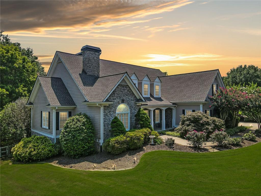 Overlooking manicured fairways and a sparkling lake, this home in Bradshaw Farm offers serene golf course living with space to stretch out and breathe. From the moment you arrive, the curb appeal is undeniable. Mature landscaping, wide driveway, and a stately front elevation set the tone for what’s inside.
The main floor features a bright and open great room anchored by a stacked-stone fireplace and vaulted ceilings. Just off the breakfast area, a sunny enclosed porch invites you to slow down and stay awhile, while the expansive back deck gives you front-row seats to the golf course. The three car garage offers additional parking for that golf cart.
The updated kitchen is both stylish and functional, with granite countertops, stainless steel appliances, and a large center island for prepping or gathering. The primary suite on the main level offers a private retreat with a second fireplace, walk-in custom closet, and soaking tub with views of the trees.
The upper level features three spacious bedrooms, each with its own ensuite bathroom. One of the bedrooms includes a private sitting area that can serve as an additional living room or retreat, offering extra privacy. A versatile bonus room upstairs provides the perfect space for teens, guests, or a home office.
The finished terrace level includes a full in-law suite with a second kitchen and laundry, offering space for extended guests, teens, or multigenerational living complete with its own fireplace and private entrance. A workshop and bonus rooms are ready to be customized for your needs: gym, media room, hobby space, or all three.
And when it’s time to step outside, Bradshaw Farm delivers with a full lineup of amenities: golf, clubhouse, tennis courts, pools, and playgrounds, all just a quick walk or cart ride away.
This one checks every box and then some.