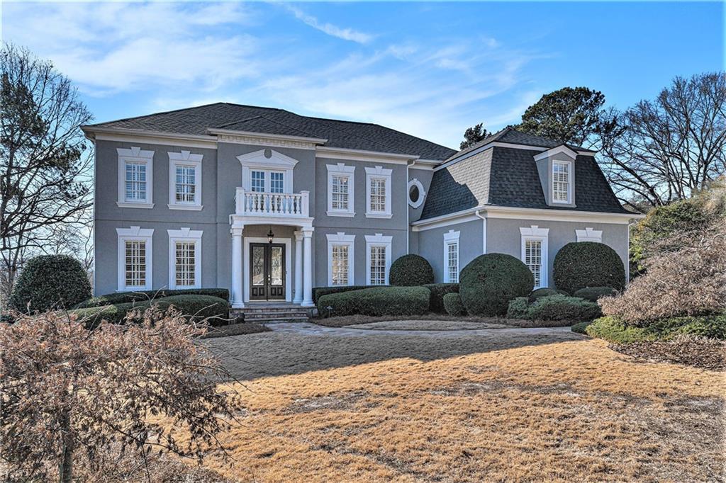 This fabulous custom built home perfectly blends luxury, style and convenience, all overlooking the Chattahoochee River valley in the desirable Rivercliff community. Step into this meticulously maintained, one owner home. Features soaring Foyer with crystal chandelier and two story Living Room with gleaming new hardwood floors that meld with the original hardwood floors. The Living Room will draw you right in with the floor to ceiling wall of windows providing lots of natural light, built in bookshelves and fireplace. Gracious sized Dining Room that easily seats twelve guests. The main floor was built for entertaining with chef's Kitchen that overlooks Breakfast Room and spacious vaulted Family Room, a Service bar, Screened Porch and rear Deck. Powder Room, Guest Bedroom with ensuite bath and separate well appointed Office with beautiful cherry cabinets and shelves. Upstairs the oversized Owner's suite offers a welcome escape from the day, featuring trey ceiling, a fireplace, sitting room, morning kitchen, two walk-in closets including a cedar closet and a laundry chute to the main level laundry/mud room. The ensuite Owners Bath boasts a separate bidet toilet, wrap around double vanity, dual steam shower with bench and large jacuzzi soaking tub. Also on this level is another bedroom/home office with security closet and children's suite of two secondary bedrooms with a Jack n Jill Bathroom. The Terrace Level is also ideal for entertaining with it's high ceilings, large Rec room, full bar with seating, dishwasher, microwave. A wine cellar that can hold over 350 bottles and a refrigerator. Large Gym with mirrored walls, ballet bar and rubber tiled floor for all your workout needs. Two guest Bedrooms a full bath and a half; over 800 sq ft of extensive storage and utility room along with walk out patio access to the backyard making this ideal for in-laws, au pair or teenagers! Two garages can accommodate 4 cars and has parking pad for additional parking with kitchen level entry. Rest, relax and enjoy the backyard which features a fenced and hedged lawn with a covered Patio, Screened Porch and Grilling Deck. All this overlooking your yard that backs up to the community open space. Tucked away is a private firepit and seating area to the right of the driveway. Enjoy fireside chats on chilly evenings. This NE facing executive estate sits on a generous three quarter acre lot with a beautiful wooded view. The hard coat stucco is brimming with European charm and character. It's nestled in this serene cul de sac in one of Marietta's most desirable neighborhoods. It's a prime location in heavily sought after Sope Creek ES, Walton HS and a short drive to Atlanta's top private schools while benefitting from low Cobb county property taxes and efficient government. This home is truly in a prime location – located right off Columns Drive along the Chattahoochee River with close proximity to walk, run, bike or kayak right from your front door. All this in an active swim/tennis community, a short drive to Sandy Springs and also conveniently close to Atlanta Country Club. Easy access to I-285, Hwy 400 and I-75. Come see this home and choose not just a home but a lifestyle-for entertaining, living and creating memories.