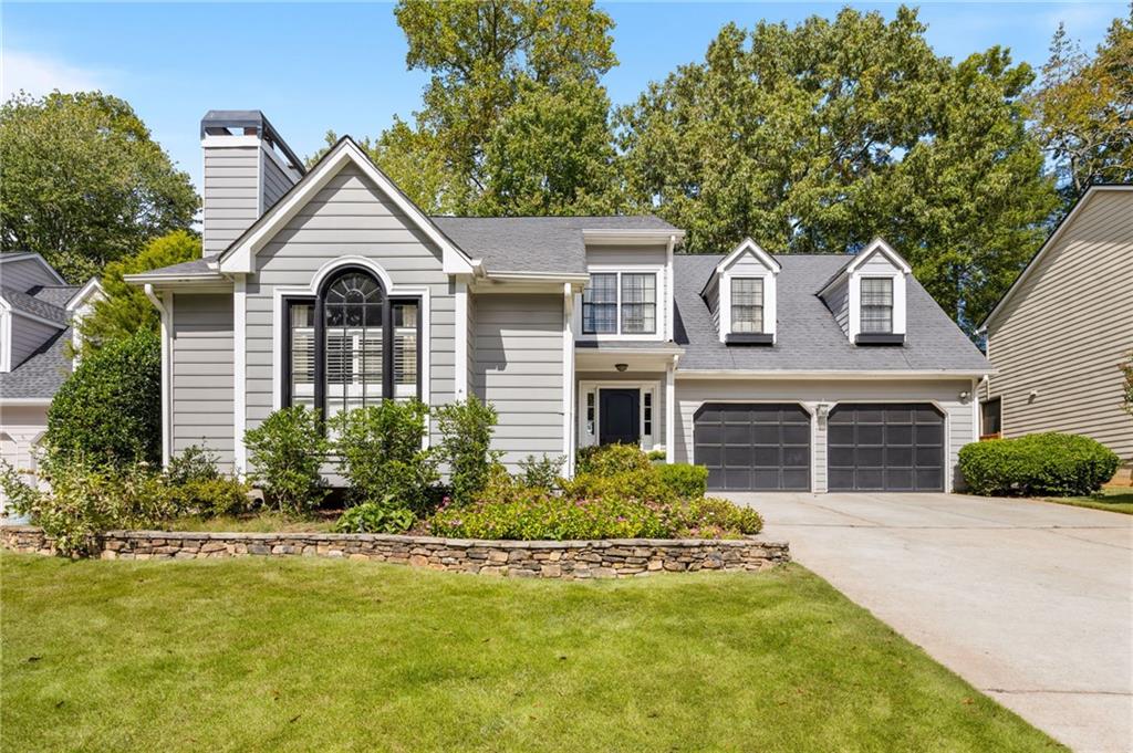 Tucked away on a quiet dead-end street in the heart of Brookhaven, this open-concept home with a two-car garage blends thoughtful design with everyday comfort. Vaulted ceilings and a cozy fireplace create a warm and airy feel in the family room, while the kitchen features white cabinetry, a sleek glass tile backsplash, and open sightlines to the dining area—perfect for easy entertaining. Hardwood floors flow throughout the main level, which also includes a powder room and a convenient laundry room. Upstairs, a custom built-in landing adds charm and function. The spacious owner’s suite offers a peaceful retreat with a sitting area, custom closets, and a spa-inspired bath featuring double floating vanities, a glass-enclosed shower, and a separate soaking tub. Two additional bedrooms—each with ceiling fans—provide ample space for guests or family. Enjoy outdoor living year-round from the screened-in porch overlooking a private, fenced backyard. With top-rated schools and Brookhaven’s best shopping, dining, and parks just minutes away, this home offers location and lifestyle in one inviting package. Lynwood Park is one of Brookhaven's most beloved neighborhoods, known for its active community, splash pad, basketball courts, playground, and close proximity to local favorites like Avellino's and Osborne Dog Park.