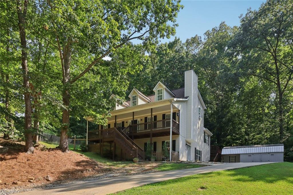 Charming Cape Cod Retreat with Finished Basement Suite | Prime Lumpkin County Location
Welcome to your peaceful wooded paradise! Nestled on a private lot just off GA 400 North at Whelchel Road, this beautifully maintained Cape Cod-style home offers timeless charm, updated finishes, and room for everyone — all in a location that puts North Georgia’s best right at your doorstep. From the rocking-chair front porch to the expansive back deck surrounded by nature, this home invites you to slow down and enjoy the serenity. Main Floor Highlights: Inviting open-concept layout filled with natural light. Cozy fireplace creates the perfect focal point for relaxing evenings Large kitchen with granite countertops, stainless steel appliances, and crisp white cabinetry Sunny breakfast room plus separate dining area. Primary suite on main with adjacent laundry for easy single-level living, Convenient half bathroom for guests. Access to oversized wood deck ideal for grilling, entertaining, or birdwatching in peace. Upstairs Retreat: Two generous secondary bedrooms with ample closet space. One full bathroom with tasteful updates. Finished Terrace-Level Suite: Perfect for in-laws, teens, or guests — this level has it all!! Bedroom, full bathroom, and laundry. Spacious living area and bonus room. Private entrance. Space prepped for a kitchenette — ideal for a separate suite or rental opportunity Exterior & Extras: Lush, wooded lot offering peace, privacy, and plenty of wildlife.
Full-length front porch — quintessential Southern charm. Newer storage building for tools, toys, or gardening gear. Gorgeous hardwood flooring, updated kitchen & bathrooms throughout. Tons of natural daylight in every room. Unbeatable Location: Minutes from Dawsonville Outlet Mall, Lake Lanier, Chestatee River access, and the wineries of Dahlonega & Helen.
Quick access to Hall, Forsyth & Dawson Counties. Convenient to the new Lumpkin County hospital and top-rated schools. Outdoor lovers’ dream — kayaking, fishing, hiking & more just around the corner!. Your North Georgia Dream Home Awaits! Whether you're searching for a private family home, multigenerational setup, or a peaceful getaway with rental potential — this one has it all. Schedule your private tour today and fall in love with the lifestyle this home offers! * Please check school information for latest updates*