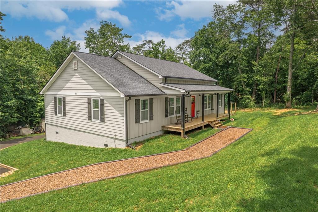 Come and make this your home! This beautiful community has a 22 acre lake with a swim dock, picnic pavilion area and boating and fishing! Come see this beautiful almost new 3 or possibly 4 bedroom, 2-Bath home with open concept living, nestled on a peaceful 2.43 acre lot in Jasper, GA. Inside, you will find a spacious master suite with an oversized, beautifully tiled shower, double vanities, and a huge walk-in closet. The open main living area is welcoming with engineered hardwood floors throughout the living room, dining area, kitchen, and master bedroom. This kitchen is a showstopper complete with a large butcher block island, matching butcher block countertops, white cabinetry, a classic subway tile backsplash and recessed lighting. The flexible bonus room would be perfect for a home office, extra bedroom or playroom. Outdoors, the possibilities are endless. The huge front yard and spacious back deck provide the perfect setting for entertaining, gardening, or relaxing. A small creek runs through the back of the property, creating the ideal spot for a firepit and gathering area under the stars. There's plenty of room for a future pool or garden space. Additional features include a large crawlspace that is ideal for storage, a workshop, home office, or even a storm shelter Don't miss your chance to own this special property!