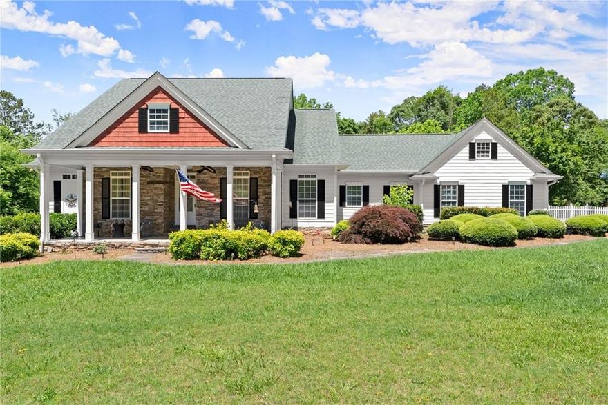 Looking for a private residence with loads of space and NO HOA? Welcome to this custom built ranch over basement home featuring 4 bedrooms, 3.5 baths, and a finished basement all situated on a flat 1.8 acre lot. This home sits back from the road with a extended private driveway leading to the 2 car, side entry garage with extra parking pad. Walk up to the charming covered front porch with cozy stone accents and seating areas complete with ceiling fans where you can relax and look over your property. Enter the home to be greeted by classic hardwood flooring, neutral paint, and loads of natural light. Just off the foyer is the formal dining room with direct access into the kitchen, making this a fantastic place to entertain. Continue on into the main living quarters where you will find an open concept space with your family room, kitchen, and breakfast nook. The family room offers custom features such as a double trey ceiling, builtins, and beautiful fireplace with wood mantle. Move into the kitchen where you will find wood cabinets, lots of counter space, a tile backsplash, granite countertops, a center island with storage, and a view into the family room. Just off the kitchen is a casual dining space, pantry, half bath, and laundry room with additional cabinets for storage. The oversized master suit offers a trey ceiling, direct access to the enclosed back porch, walk in closet, and an en suite bath. The master bath features a huge tile shower, soaking tub, and double sinks. The secondary bedrooms are also spacious and share the second full bath with double sinks and shower-tub combo. Move down to the finished basement where you will find loads of bonus living space to use in your own way. There are multiple flex spaces including a large media/secondary sitting room, game room, play room, gym, and home office. Additionally, another bedroom and full bath are located in the basement making this great for a guest area or teen suite. Enjoy multiple outdoor living spaces overlooking this sprawling, private 1.80 acre lot including the rocking chair covered front porch, a glass enclosed sunroom, a screened in back porch, an open air deck, and a covered lower patio off the basement. This flat lot has endless possibilities with plenty of space to add a pool, garden, fire pit, or animals. This home is centrally located with easy access to local shopping and restaurants, as well as top Cherokee County schools, and local parks. Enjoy seclude, private life all within minutes of multiple thriving Downtown areas with community events, additional restaurants, concerts and more. Downtown Ball Ground is just 15 minutes away, while Downtown Canton and Cumming are within 30 minutes, and Downtown Woodstock 45 minutes. This home really offers it all! negotiation.