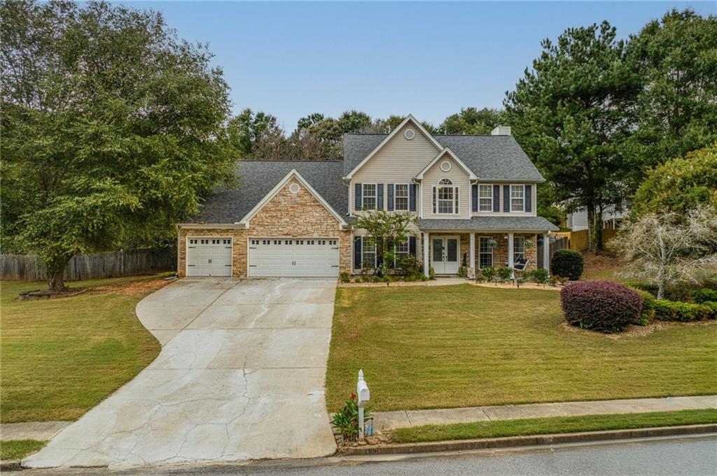 Welcome to this beautifully updated home on 1.5 acres in the highly sought-after Berwick Glen community. Sitting at the end of a quiet street, this property offers rare privacy in both the front and back yards. Beautifully cared-for landscaping and newly replaced front entry doors enhance the home’s curb appeal and welcoming presence while inside, thoughtful updates make it truly move-in ready. The kitchen has been opened to the living room for a seamless flow, featuring modern upgrades, brand new granite countertops and backsplash, a custom coffee station and wine rack, and a renovated living room with built-in shelving and tile accents behind the fireplace. A main-level bonus room offers flexible space for an office or playroom. Brand-new luxurious light fixtures elevate the home’s style and ambiance. Upstairs, the oversized owner’s suite includes his and hers walk-in closets and a spacious sitting room, while two secondary bedrooms now feature private bathrooms thanks to a recently added fourth full bath. The rare three-car garage with brand-new epoxy floors provides ample storage, and the fully fenced, oversized backyard is a private retreat ideal for entertaining, gatherings, or simply relaxing. Located in the highly rated Archer High School district and close to shopping, dining, and major conveniences, this home combines space, style, and privacy in a prime location.