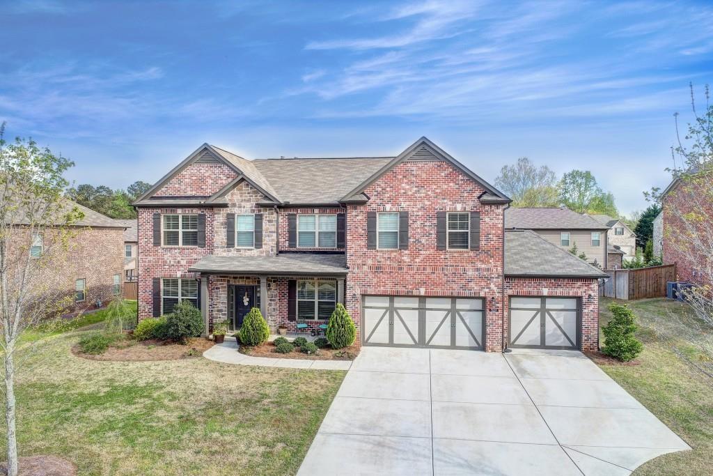 Exceptional value in a gated community. This 5 bedroom, 4 full bath residence offers timeless curb appeal with 3 side brick construction and spacious 3 car garages. Main level boast gleaming hardwood floors, an open-concept layout, a chef's kitchen, and guest suite with full bath. upstairs, retreat to spacious owner suite with spa-style bath and generous walk-in closet. Additional bedrooms provide comfort and flexibility, while the highlight of the second floor is a large open media room-ideal for movie nights and entertainments. This home combines security, style, and unmatched value.