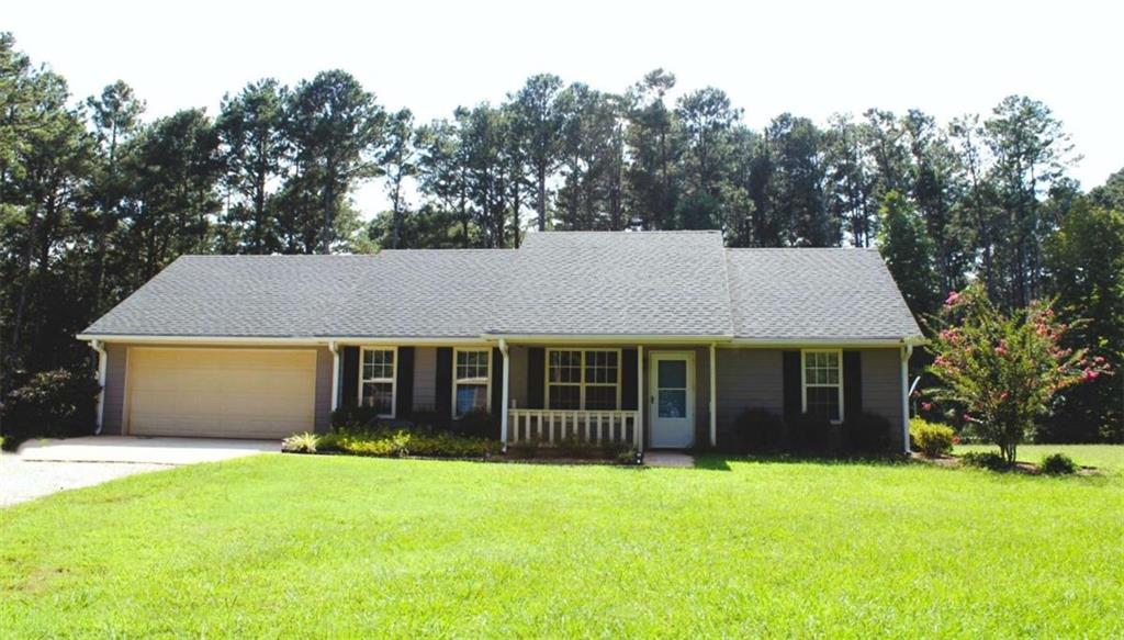 SELLER IS OFFERING $5,000. FOR A BUYDOWN RATE! A $1,500. LENDER CREDIT WITH PREFERRED LENDER! Beautifully maintained ranch style home on 3.35 private acres! The home has been well maintained with updates in the past couple of years including a tiled shower in the master bath, carpeting, gutters, granite countertops in the kitchen, dishwasher, built-in bookcase in the family room, and screen porch w/ removable plexiglass windows for year round enjoyment! The home is a split bedroom plan, and includes a living room/home office, separate dining room, and massive family room with a wood burning stove. The kitchen has granite countertops and a tiled backsplash, stainless appliances including a refrigerator. The newly added screen porch has vaulted wood ceilings, recessed lighting, and usable year round with easy to install plexiglass windows included. A great place to enjoy your morning coffee! Additionally, there are 2 decks and a fenced area for your pets! The home has a 2 car garage with additional storage space, and a detached carport/RV storage. There is a storage barn and a separate workshop for outdoor lawn equipment. 3.35 private acres, with plenty of room for a pool, horses, and outdoor entertainment. The property is also partially wooded for privacy. This property is a must see! Ready for your own private paradise, but yet close to the City of Social Circle and convenient to I-20? This is the one! AT&T Fiber High Speed Internet. Preferred lender Element Funding is offering a $1,500. lender credit! .