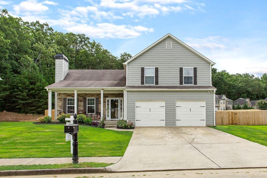 Don't miss this gorgeous, perfectly updated family home in popular Arbor Chase, just off 278! This home does not disappoint! Some upgrades include new waterproof flooring in kitchen, living and dining rooms, stainless appliances, and new granite countertops in kitchen and all bathrooms! You'll love this huge lot (2nd largest in neighborhood), fenced with wooden privacy fence! Irrigation system is in place for new landscaping! New fixtures throughout home, as well!  You'll love the well-appointed front porch, as well as the decorator details in this home!  Call today!