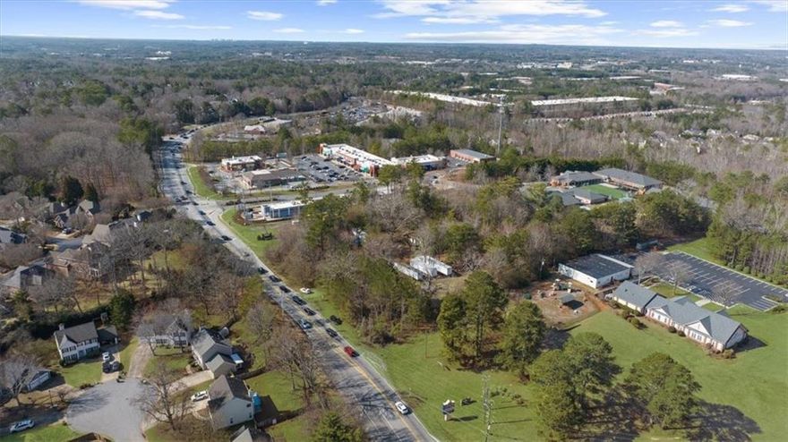 **Prime Commercial Opportunity in Alpharetta!**  
Welcome to 5370 McGinnis Ferry Road, a 2.23-acre commercial lot offering endless possibilities. This relatively level, flat property is the perfect canvas for your dream business. While an existing structure is on-site, it’s ready to be cleared, making way for new development. The impressive road frontage on McGinnis Ferry is sure to impress, as it will grant excellent visibility for your new business given it is a main thoroughfare and close to so many popular destinations!

Located in a high-demand area near a Publix anchored shopping center at McGinnis Ferry Road and Windward Parkway, popular fast-food chains, thriving residential communities, top-rated schools, affluent demographics, and major roadways, this lot boasts unbeatable visibility and accessibility. Whether you're planning a retail space, storage units, office complex, or service-oriented business, this prime location is ready to bring your vision to life.  

Seize this opportunity to invest in Alpharetta’s booming growth corridor!
