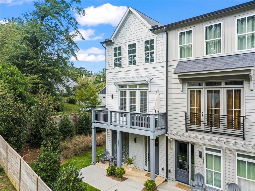 Better than new end unit townhome only minutes to the Eastside Beltline Trail! At only three years young, this absolute turn-key home will surely impress even the most discerning client. Long list of upgrades including nearly every light fixture in the home, ceiling fans in every bedroom, custom closets and pantry build-outs plus hand-selected flooring and paint color selections. Ideal split bedroom floorplan is perfect for families, roommates, or even work form home scenarios. Ground floor features the welcoming foyer and drop zone, a full bedroom and bathroom suite, as well as a sizable two-car garage with generous storage. On the main level, entertaining is a dream in this open-concept floorplan connecting all social spaces. The gourmet kitchen will delight any at-home chef (or UberEats connoisseur, we won’t judge) with its massive island, designer range hood, trendy finishes, and large pantry. Don’t miss the moody powder room and two porches on this floor! Upstairs, the primary suite is a serene retreat boasting tons of natural light from the corner windows, a luxurious dual vanity bathroom, and two walk-in closets. The additional guest bedroom upstairs is supersized and with another private bathroom and large closets. Having the laundry room on the top floor makes the inevitable chore a bit more manageable. In real estate, location is everything and this home surely delivers. End-unit floorplan offers extra windows throughout the home and quieter living on Oxley Place, not fronting Hardee Street. This charming community is steps to the Edgewood Shopping District with countless restaurant, retail and grocery options. Less than five minutes to all the fun on the Beltline too! Fee simple ownership style allows for a lower interest rate and very low HOA fee, only $169 per month. You will be hard pressed to find a better combination of size, finishes, and location for this price point. Welcome home to 1221 Oxley Place, where life is good and living is easy!
