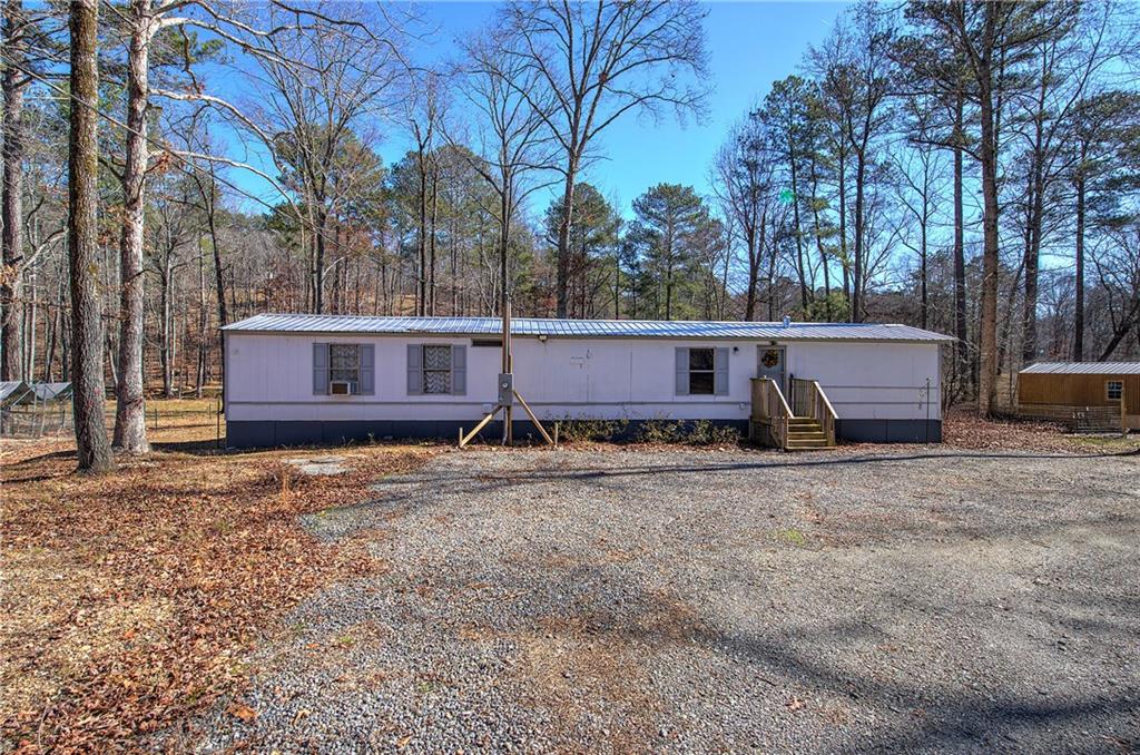 Take a look at this very unique, one of a kind property on almost 17 acres with 2 homes!!! One could be income producing or perfect for multiple families. One home is a new construction that needs to be completed, new gravel drive, hydroseeding complete, gorgeous views with lots of wildlife and beautiful creek that flows between the homes with a bridge, hunting trails, amazing landscaping, new appliances, new tin roof, soaking tub and tons of potential to make this secluded beauty what you want.