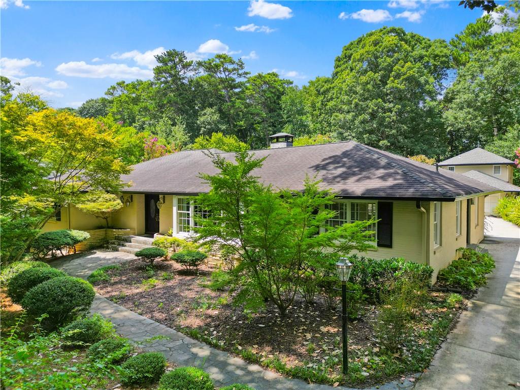 Welcome to 705 W Ponce De Leon Avenue, a captivating residence in the heart of Downtown Decatur, brimming with elegance and charm. This exquisite 3-bedroom, 4-bathroom abode offers a generous 3,318 square feet of refined living space, nestled on a sprawling .72 acre lot—perfect for those with a penchant for tending lush gardens, relaxing by the pool or simply enjoying nature's wonders, complete with a serene koi pond.
Step inside to discover an expansive, light-filled home where entertaining is a breeze. The oversized dining room comfortably accommodates gatherings for twelve or more, setting the stage for memorable evenings. Culinary enthusiasts will delight in the large open kitchen, equipped to handle everything from intimate dinners to grand feasts. Adjacent to this culinary sanctuary is a delightful four-season room, offering a tranquil retreat no matter the weather. Kitchen, den and 4 season room all have amazing views of the pool and garden.
The property boasts not only a primary residence but also a charming carriage house above the two-car garage. This self-contained suite includes a full kitchen, bedroom, and bath, providing an ideal space for guests or multi-generational living. Additionally, the pool house, with its own kitchenette and full bath, adds an extra layer of convenience and luxury.
Embrace a lifestyle of elegance and understated elegance at this exceptional Decatur address.