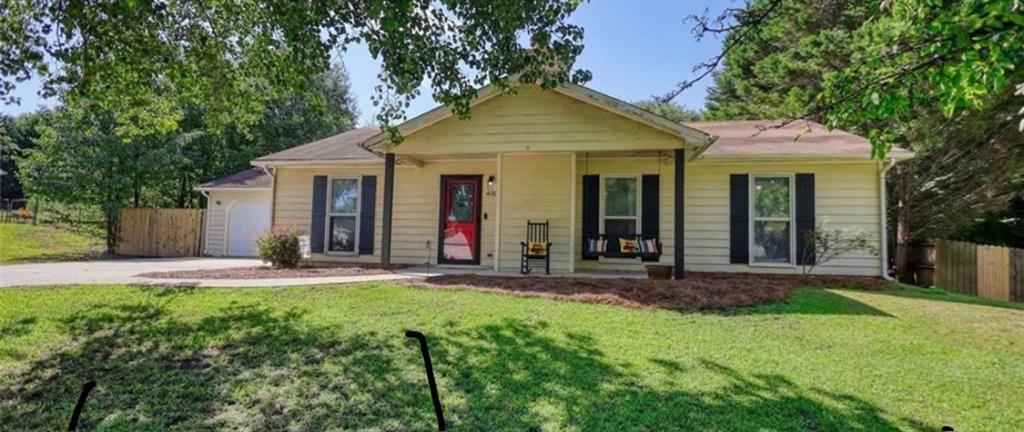 Charming Ranch Home on Nearly Half an Acre - NO HOA! Welcome to this move-in-ready ranch-style gem nestled on a spacious .46-acre lot with NO HOA! This 3-bedroom, 2-bathroom home offers the perfect blend of comfort, function, and Southern charm. Step inside to find a bright and open layout with a seamless flow between the large family room, kitchen, and dining area-ideal for entertaining or relaxing with loved ones. The oversized walk-in pantry and dedicated laundry room add convenience and ample storage for everyday living. The master suite on the main level provides a quiet retreat, while the additional bedrooms are generously sized for family, guests, or a home office. Enjoy the outdoors in your huge fenced-in backyard, perfect for BBQs, gatherings, or gardening. There's also a shed for extra storage, a two-car garage, and a large driveway offering plenty of parking. Unwind on the inviting front porch swing and take in the peaceful surroundings. Located just minutes from shopping, dining, parks, and schools, this home is perfect for first-time buyers, downsizers, or anyone looking to relocate to a quiet, welcoming area.