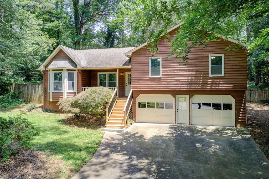 Tucked away on a peaceful cul-de-sac in the desirable Southfork Subdivision, this beautifully renovated split-level home offers the perfect blend of modern comfort and classic charm. From the moment you arrive, the inviting rocking chair front porch and expansive fenced backyard set the tone for a lifestyle filled with warmth, relaxation, and connection.
Step inside to discover a bright, open layout featuring 3 spacious bedrooms and 2 full baths. The thoughtfully designed floorplan creates effortless flow from the updated kitchen and dining area into the oversized family room, where a stunning floor-to-ceiling stone fireplace serves as the heart of the home — perfect for cozy evenings or casual gatherings.
This home checks every box:
- Fully renovated and move-in ready
- Private, wooded lot with full fencing — ideal for pets, play, or entertaining
- No HOA — enjoy true ownership freedom
- Easy access to I-575 & I-75
- Just minutes from Lake Allatoona, Hobgood Park, shopping, dining, and top-rated schools
Whether you're a first-time buyer, looking to downsize, or searching for a turn-key rental property in a prime location, this home is a rare find in one of Woodstock’s most vibrant and convenient communities.Don’t miss your chance to experience everything this gem has to offer — schedule your private showing today!??