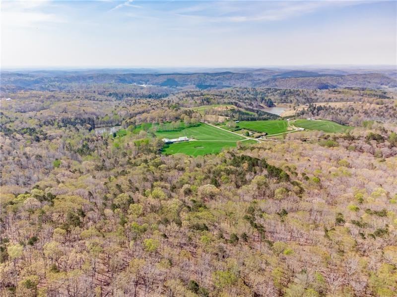 Rare Opportunity in The Bluffs at Big Canoe!
This expansive and private lot offers 356 feet of road frontage in one of Big Canoe?s most sought-after neighborhoods. The Bluffs feature their own private gate, providing an added sense of exclusivity and security for property owners. With a gentle slope, the lot is perfectly suited for an easy build, and the setting reveals breathtaking long-range mountain views?an ideal backdrop for your dream home. This is the only available lot on the street with views, making it a truly unique opportunity.