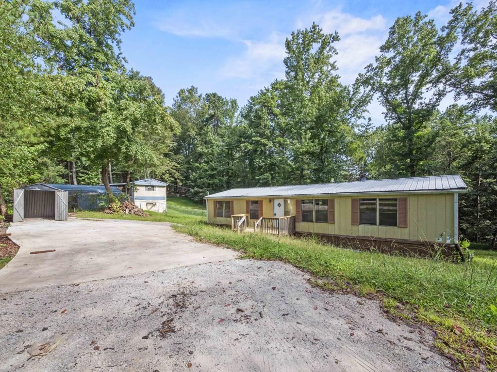 Move in ready mobile home. 3 bedrooms, 2 bath on over half an acre lot. No HOA