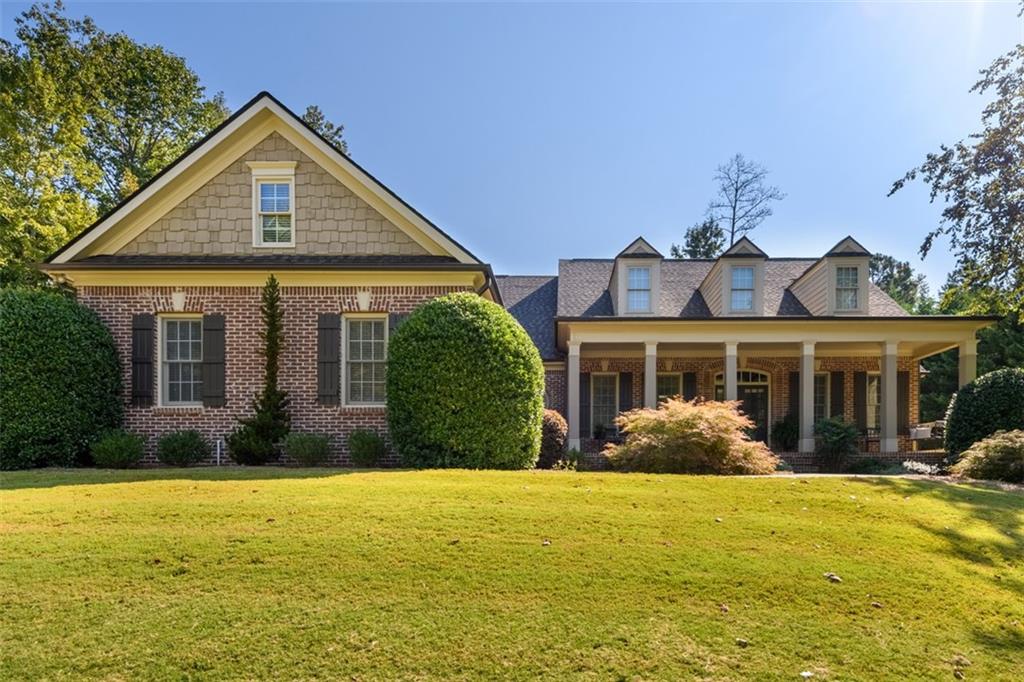 Rare find Immaculate ranch on full basement!. Estate Cape Cod Home located in the desirable Deatons Crossing neighborhood. Over half acre lot with lush landscaping, including Evergreen and Ornamental trees for privacy. As you enter through the Double door entry off the Large covered old world Brick front Porch you notice the Open Foyer. Located next to the Large Dining Room that seats12+ and includes Judges Paneling. This home has solid hardwood maple floors throughout living areas and also boasts upgraded trim and crown molding. The Large Vaulted Great Room features A stone Fireplace (Gas) and Built in Bookcases. The oversized Primary Bedroom located on main level has trey ceiling, crown molding and direct access to back screened porch. Master Bath has shower, separate jetted tub and large vanity with cherry cabinets and granite countertops and dual sinks. Also has vaulted ceiling and separate water closet.. .
large walk in master closet. Main floor powder room with cherry cabinets and granite countertops. Also Two main floor bedrooms separated by a jack and jill bath also with granite countertops. Laundry room on main with laundry cabinet and sink with Granite countertops. Kitchen has stainless steel appliances with Double ovens and gas cooktop. Custom cherry cabinets granite countertops and undercabinet lighting. pantry and Breakfast bar. Also has Breakfast Room with attached Keeping Room with vaulted ceilings and Rock Fireplace (Gas) One of the Homes outstanding features is the Large Screened in Porch with Tennessee Fieldstone floor and Rock Fireplace (Gas). Upstairs back staircase leads to two additional full bedrooms with large walk in closet and full bath with granite countertops. Also has walk in attic storage in addition this home has full unfinished daylight basement stubbed for bath..Two car garage with epoxy floors and extended concrete parking pad in Driveway. This home is a must see and Move in Ready. It is also located less than two miles from the new Northeast Georgia Medical Center of Braselton. Close to shopping, Restaurants and approx six miles to the shores of Beautiful Lake Lanier. Also close to Interstate 1-85 and I-985. Please call for a Showing of this Fabulous Home!