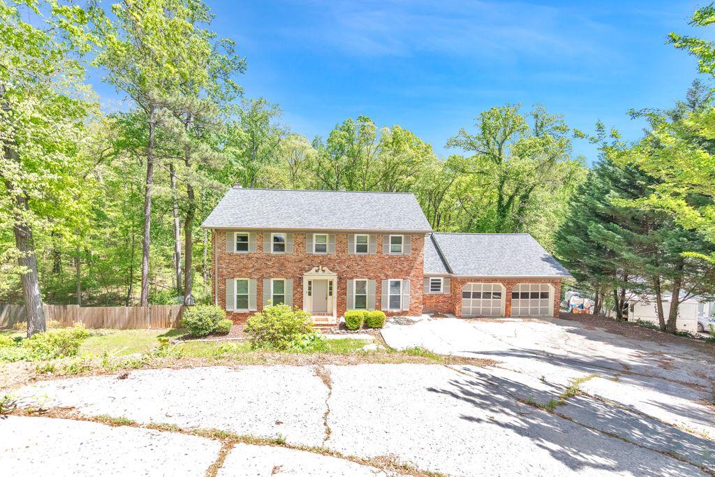 Welcome to this stunning 4-bedroom, 2.5-bathroom home located in the highly sought-after Walton High School district. As you enter, you're greeted by a grand foyer leading to a separate dining room and sitting room on either side. The sitting room flows seamlessly into the fireside family room, featuring built-in bookcases, bay windows, and a door opening to the expansive sunroom with vaulted ceilings. The kitchen boasts a breakfast bar, stone counters, updated appliances, and a charming breakfast room. A convenient laundry room and a half bathroom complete the main level. Upstairs, you'll find the luxurious primary bedroom suite with an ensuite bathroom featuring a sleek glass shower. Three additional bedrooms on the upper level share a full bathroom. The large unfinished basement provides ample storage space and has a door leading to the backyard. Outside, enjoy the large uncovered deck and a covered patio beneath it, overlooking the inviting in-ground saltwater pool. This home also features an attached 2-car garage. Located in a great East Cobb location, you'll have easy access to Downtown Roswell, the Chattahoochee River, plenty of shopping and dining options, and major roadways. Don't miss out on this incredible opportunity to live in this beautiful home!