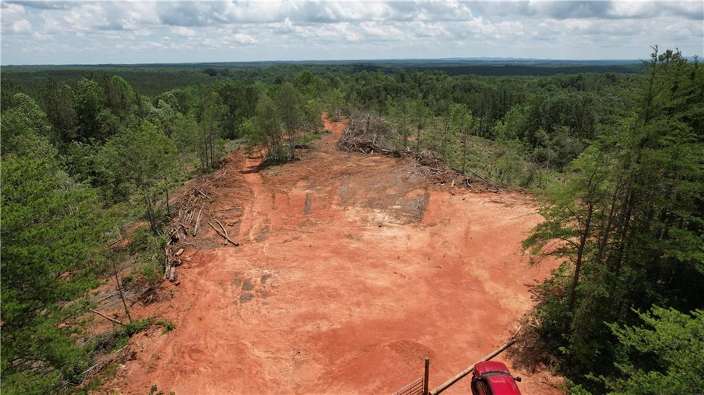 Acreage is perfect for an private estate home, farm or family compound. With gently rolling terrain, open skies, and wide-open potential, this land is ready for your vision. It offers both seclusion and accessibility — a unique find in North Georgia