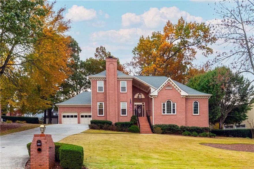 A refreshed all-brick classic in one of Lawrenceville’s most character-filled neighborhoods. Tucked inside Cramac Plantation, an established enclave with an optional HOA just minutes from downtown Lawrenceville, this home is a breath of fresh air in a sea of cookie cutter communities. Every house here has a story, and this one’s been thoughtfully renewed for its next chapter. Inside, fresh paint throughout and newly installed tile floors in the kitchen and laundry room give the home a crisp, updated feel without losing its timeless charm. The main level opens to elegant living and dining spaces anchored by a gas fireplace, while the vaulted eat-in kitchen offers new appliances (including a new ceramic convection cooktop, convection wall oven, wall microwave, and dishwasher), real wood cabinets, generous counter space, and a bright breakfast area that overlooks a cozy fireside den with beautiful natural wood built-ins and a second fireplace; the den is easily everyone's favorite room in the house. The spacious primary suite on the main level feels like a true retreat, complete with a private sitting room, screened porch, dual closets, and a spa-inspired bath with a jetted tub, a large walk-in shower, and dual vanities. Upstairs you’ll find three spacious bedrooms, a full bath, and a large floored attic perfect for future expansion or easy storage. Downstairs, the daylight finished basement provides incredible flexibility, featuring a wet bar, media and game areas, plenty of room for a home gym and so much more, plus an expansive unfinished section ideal for storage or a workshop. Step outside to a large low-maintenance Trex deck, perfect for grilling, entertaining, or relaxing in the hot tub surrounded by mature trees. Additional storage can be found under the deck. The mostly level backyard is private, shaded, and ready for gatherings, playtime, or a quiet morning coffee. With newer HVAC systems, upgraded windows, a new front door on order, and easy access to downtown Lawrenceville’s shops, restaurants, and events, this home delivers both comfort and character, a rare combination. In a neighborhood that values individuality, this is where lasting memories are made.