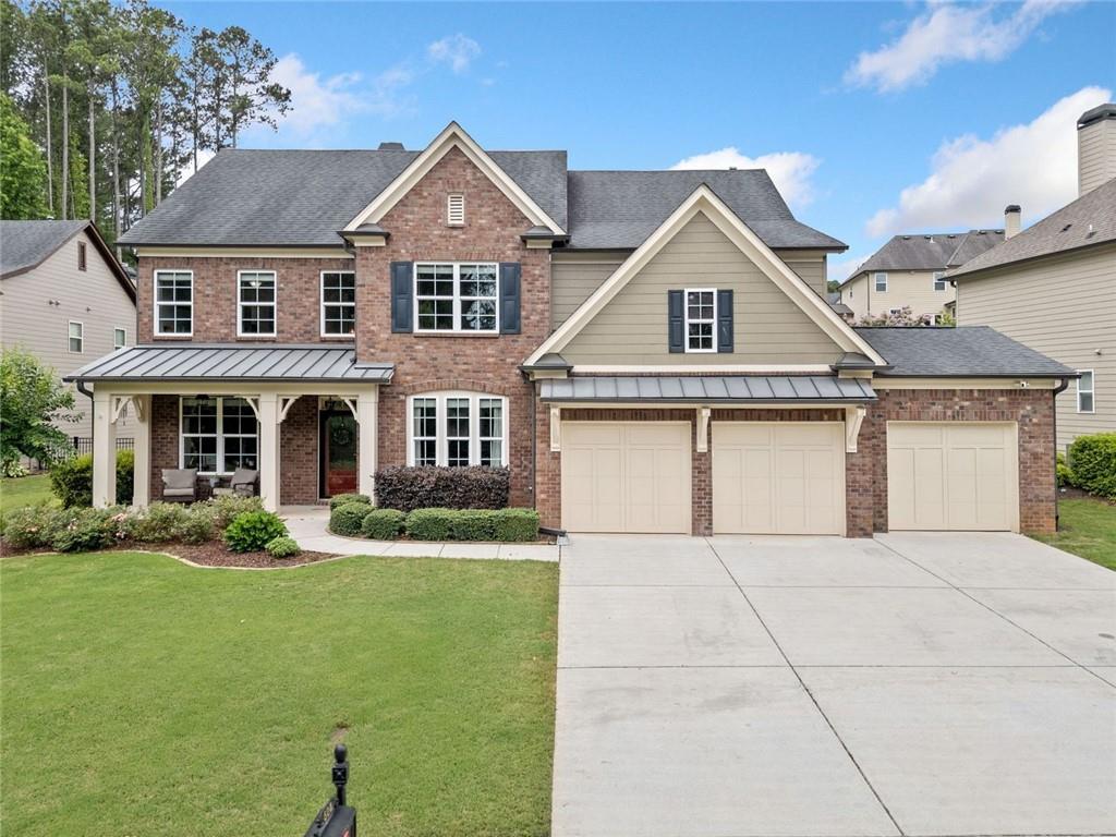 Welcome to refined living in Woodstock Knoll! This beautifully appointed, lovingly maintained, brick-front traditional home offers 5 bedrooms and 4 full bathrooms across two spacious levels, designed for both everyday ease and elegant entertaining. With beautiful curb appeal, a 3-car garage, and exceptional outdoor living spaces, this home blends comfort, functionality, and style. Inside, you’ll find the open-concept kitchen, dining area, and family room make everyday living and entertaining a breeze. Just off the kitchen, enjoy a covered and screened back patio that opens to a professionally landscaped and hardscaped backyard complete with a built-in fire pit and outdoor kitchen - perfect for relaxing evenings and outdoor gatherings. The main level also features a formal dining room, a front sitting room or office, a guest bedroom with a full bath. Upstairs, the spacious primary suite features a spa-like bath with separate his and hers vanities, a soaking tub, and a frameless glass shower. Three additional secondary bedrooms include a Jack-and-Jill bath and a private en-suite. A large bonus room offers flexible space for a playroom, media room, or home office.The oversized 3-car garage offers plenty of room for vehicles, storage, or even a golf cart - ideal for exploring the Downtown Woodstock “Golf Cart Zone.” Located in one of Woodstock’s most desirable communities, Woodstock Knoll offers resort-style amenities including a clubhouse, swimming pool, tennis courts, and an active, welcoming neighborhood. This is the one you’ve been waiting for!