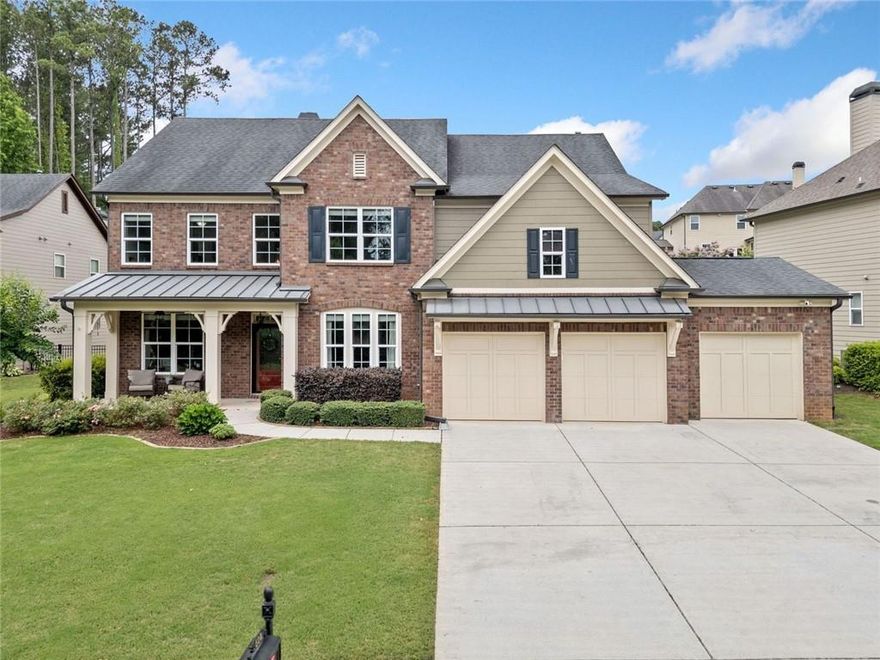 Welcome to refined living in Woodstock Knoll! This beautifully appointed, lovingly maintained, brick-front traditional home offers 5 bedrooms and 4 full bathrooms across two spacious levels, designed for both everyday ease and elegant entertaining. With beautiful curb appeal, a 3-car garage, and exceptional outdoor living spaces, this home blends comfort, functionality, and style. Inside, you’ll find the open-concept kitchen, dining area, and family room make everyday living and entertaining a breeze. Just off the kitchen, enjoy a covered and screened back patio that opens to a professionally landscaped and hardscaped backyard complete with a built-in fire pit and outdoor kitchen - perfect for relaxing evenings and outdoor gatherings. The main level also features a formal dining room, a front sitting room or office, a guest bedroom with a full bath. Upstairs, the spacious primary suite features a spa-like bath with separate his and hers vanities, a soaking tub, and a frameless glass shower. Three additional secondary bedrooms include a Jack-and-Jill bath and a private en-suite. A large bonus room offers flexible space for a playroom, media room, or home office.The oversized 3-car garage offers plenty of room for vehicles, storage, or even a golf cart - ideal for exploring the Downtown Woodstock “Golf Cart Zone.” Located in one of Woodstock’s most desirable communities, Woodstock Knoll offers resort-style amenities including a clubhouse, swimming pool, tennis courts, and an active, welcoming neighborhood. This is the one you’ve been waiting for!