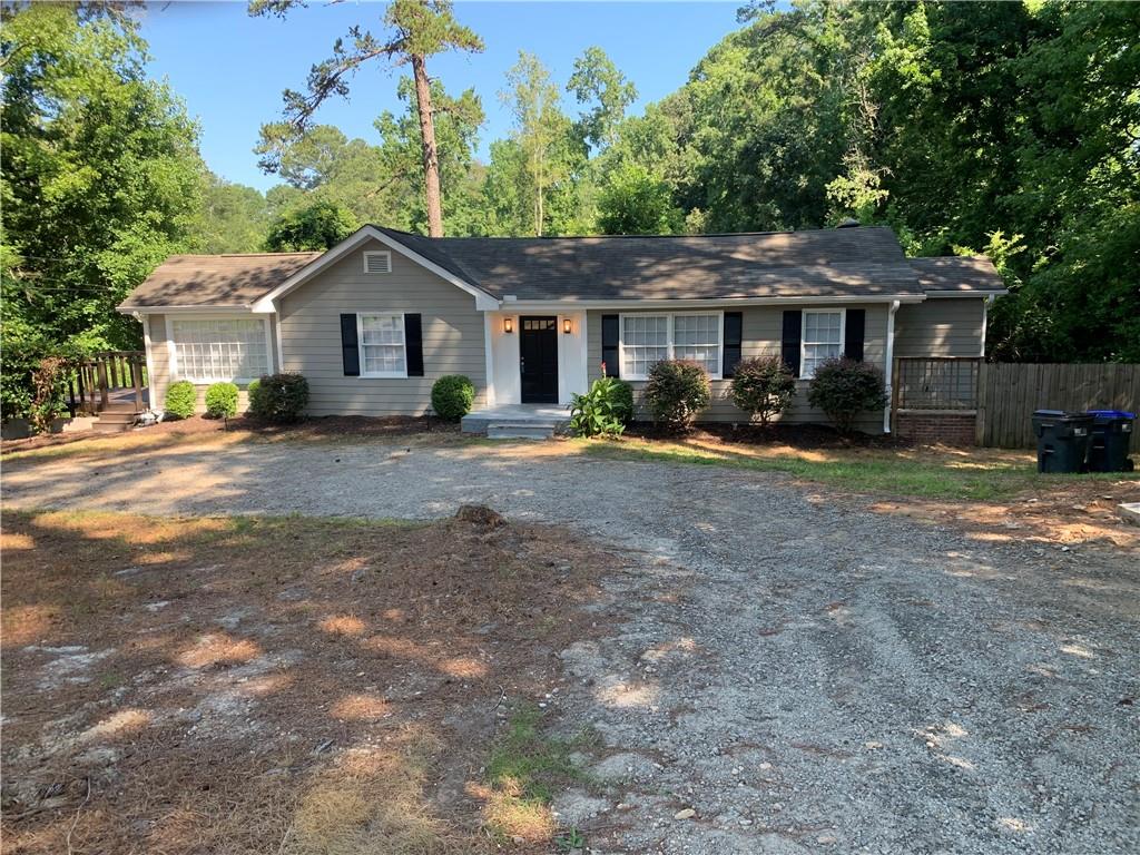 WELCOME HOME TO THIS BEAUTIFULLY REMODELED RANCH HOME IN SUGARHILL. QUIET AND PEACEFUL IT SITS WAY OFF THE ROAD ON+/- .5 ACRE LOT. NO HOA. MOVE IN READY. JUST UP THE STREET TO EE ROBINSON PARK AND SUGARHILL ELEMENTARY. WALKABLE TO DOWNTOWN SUGARHILL. KITCHEN FEATURES NEW STAINLESS-STEEL APPLIANCES, GRANITE COUNTER TOPS, TILED BACKSPLASH AND PLENTY OF CABINET SPACE. THERE IS A DINING ROOM AREA AS WELL. OFF THE KITCHEN IS A LAUNDRY ROOM . THERE ARE THREE LARGE BEDROOMS. THE MASTER BATHROOM HAS BEEN COMPLETELY REMODELED WITH DOUBLE VANITY SINK AND NEW TILED SHOWER. THE THIRD BEDROOM HAS A FULL REMODELED BATHROOM AND A FIREPLACE THAT CAN BE USED AS A BEDROOM, OFFICE OR PERSONAL ROOM. OPEN FLOOR PLAN FROM THE KICHEN TO THE FAMILY ROOM. PLENTY OF WALL SPACE TO HANG A TV OR YOUR PICTURES TO PERSONALISE THE HOME. LARGE FENCED YARD FOR KIDS TO PLAY IN. THE OWNER HAS THOUGHT OF EVERYTHING TO MAKE THIS HOME A NICE PLACE TO LIVE.