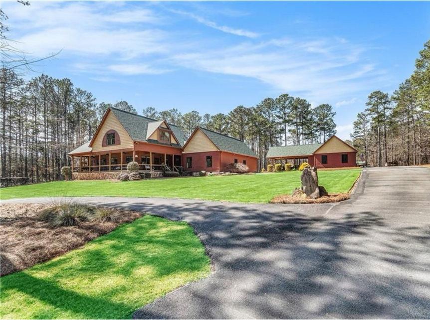 Exquisite Gated Estate on 10.936 Acres – Luxury Living with Resort-Style Amenities. Discover the perfect blend of elegance and comfort in this breathtaking 10.936 acred gated estate, offering privacy, space and top-tier amenities. From the moment you arrive, the Cracker Barrel-style front porch welcomes you with its classic charm, setting the tone for this stunning retreat. This home was built for entertaining from the moment you walk in! Main floor adorned with gorgeous hardwood floors, where every detail has been thoughtfully designed. The chef’s kitchen is a dream, featuring updated appliances and a bright breakfast room for casual dining. Adjacent to the kitchen, the dining room overlooks the massive family room, offering a seamless flow for entertaining. The family room is a true showpiece, highlighted by a romantic fireplace framed by a striking stacked stone wall, creating a warm and inviting atmosphere. A dedicated home office with private access to the front porch makes working from home a breeze. This level also boasts a private guest suite with a full bath, a convenient laundry room, and an extensive master bedroom, luxurious spa retreat and a closet that no-one will have to fight for space! Also includes a 5x12 walk-in safe. Comfort and privacy continue upstairs with a SECOND master suite, featuring a spacious bathroom and abundant storage. Additional 4th bedroom with private en-suite bathroom offers luxury and convenience, ensuring everyone enjoys their own private space. With thoughtful design and ample room for relaxation, the upper level of this stunning home provides the perfect blend of comfort and function making the prefect retreat for guests or multi-generational living!
Step outside and experience a backyard built for relaxation and entertainment with this resort-style outdoor oasis - with established landscaping & up-lighting. The oversized deck is perfect for grilling and gathering, while the in-ground pool with a tanning ledge invites you to soak up the sun in style. A pavilion with soaring vaulted wood ceilings creates a stunning space for outdoor dining or summer movie nights under the stars. Pool house offers a game room and full bath, ensuring guests have everything they need for all-day fun. For added convenience, a huge storage room sits above the garage and pool house, providing ample space for seasonal items, recreation gear, and more. As the sun sets, gather around the large firepit, the perfect spot for roasting marshmallows, sharing stories, and enjoying cool evenings under the open sky. This incredible outdoor retreat is designed for both relaxation and entertainment—don’t miss the chance to call it yours!
Beyond the entertainment spaces, this estate offers incredible functional amenities. The back side of the property features multiple covered parking areas, a 20 x 20 enclosed storage shed, 12 x 20 lean to and 40 x 35 pole barn for equipment, boats, RV & more. A flat, open area is ideal for skeet shooting, while scenic walking trails wind through the property, providing a peaceful escape into nature.
This exceptional property is a true retreat, offering the perfect balance of luxury, recreation, and country charm. You do not want to miss out on the opportunity to own this home - only the 2nd time its come on the market for sale! Now is your time!!
