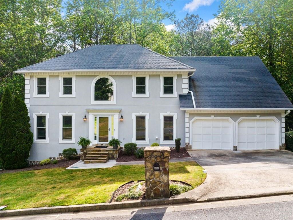 Fantastic large home in the heart of Johns Creek, located in a popular swim/tennis community and top-rated school district. Situated on a huge lot with a literal forest for your back yard, you will smile when you walk out on either of these new double decks. Traditional layout with formal living and dining rooms, fireside family room and spacious kitchen with tons of cabinetry. The breakfast room will fit your largest circular table and the main floor laundry room is gigantic, washer and dryer remain, laundry sink and tons of storage shelves. Upstairs boasts a beautiful primary suite with nice bathroom and walk in closet. There are 3 additional bedrooms, one with private bath, and a hall bathroom. Terrific storage in the gigantic basement. One small room is finished. Lawn Care IS included in the rent. The Johns Creek area is so vibrant with Newtown Community Park just a short walk away, Big Creek Walkways/Bikeways close by and every shopping and restaurant option you could ever desire. Ready for immediate occupancy.
