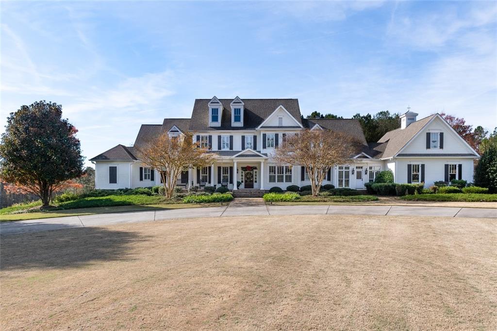 A truly magical Oconee County farm is brand new to the market! This totally private and custom built home has an amazing amount to offer. Situated on a beautiful 50 acre tract of land with 2 ponds, fully fenced, amazing custom home, a fully decked out barn, a horse barn, and 2 more barns with one of them having more living quarters. The property is fully fenced with the exterior being double fenced to maintain your property. The main house offers an amazing space. the main level offers an open concept that flows into your own private backyard oasis. Salt water gunite pool with pool house overlooking your land. Entertain inside in the custom kitchen that flows into the open living area and large keeping room. The master suite will not disappoint. Custom cabinets along with a custom on suite with a massive walk in closet. 5 extra bedrooms and 3 extra baths will offer plenty of space for the children or guest. The "Georgia Barn" will be a husband's dream. Huge open living area to watch the games with a kitchen/bar area. 2 more bedrooms with a full bath in the "Georgia Barn" as well. The front of the property also has 3 more barns, 2 used for farm and equipment storage and one has more living space to either rent or to use for a family suite for guest. This property has so much more to list but is a must see in person!