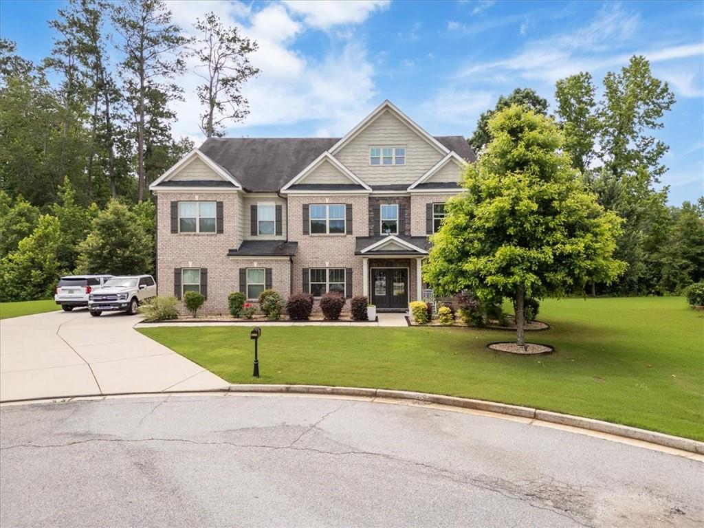 This stunning home in Vineyard Place sits at the end of a peaceful cul-de-sac, offering both privacy and space. With three expansive stories, this residence boasts 6 spacious bedrooms and 4 luxurious baths, making it ideal for an extended family or those who love to entertain.
Upon entering, you're welcomed into a grand, open-concept living area that seamlessly blends comfort and style. The main floor features a guest bedroom, perfect for visitors or multigenerational living, along with a dedicated office/study space that provides the perfect setting for working from home. With three separate living spaces, there's no shortage of room for everyone to spread out or come together for family gatherings.
The heart of the home is the chef-inspired kitchen, which effortlessly flows into a charming sunroom—ideal for enjoying morning coffee or relaxing while soaking in natural light. A formal dining room, large enough to accommodate your extended family, completes the main living area.
For more intimate meals, the cozy dining nook offers the perfect space for everyday dining, making sure your home meets every need, from casual family dinners to special occasions. Whether you're hosting or relaxing, this house truly has it all!
The oversized primary bedroom is a retreat to the eyes, featuring a double vanity and generous his/her closets that offer plenty of storage. The remaining bedrooms are generously sized as well, each with ample closet space to accommodate a growing family.
The third floor is the crown jewel of the home, offering the ultimate privacy for family members who need their own space. This level includes a spacious media room, perfect for movie nights or game days, as well as two additional bedrooms that are perfect for teenagers, guests, or a home gym. With its own separate living areas, the third floor makes for an ideal retreat while still keeping you connected to the heart of the home.
