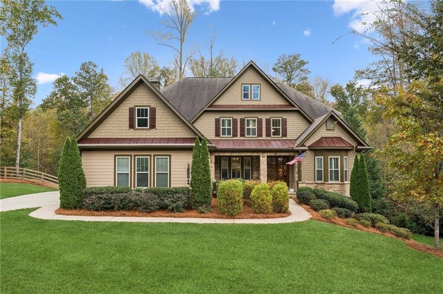 Resort living in your own home. This exceptional 6-bedroom, 6-bathroom estate sits on 1.55 private acres and features fresh paint inside and out, dual covered decks, and the convenience of both a primary suite and a guest suite on the main floor. Upon entering, you’re welcomed into a spacious family room with coffered ceilings and a wood-burning stone fireplace. The space flows into the open gourmet kitchen, complete with a large island, stainless steel appliances, and an oversized hidden pantry. Adjacent to the kitchen is a bright breakfast/keeping room with access to a covered deck overlooking the private backyard. A banquet-sized dining room with elegant wainscoting provides the ideal setting for gatherings and special occasions. The main-level primary suite features separate vanities, a spacious shower, a soaking tub, and a walk-in closet with a divided space. A spiral staircase inside the closet leads to an incredible private spa and Artisan custom closet, featuring a steam shower, sauna, multi-person jacuzzi tub, heated floors, and a dedicated massage room, amenities rarely found in a private residence. The terrace level also offers a full gym, custom bar, home theater with reclining leather seating, and a spacious game/play area for everyone to enjoy, and access to another covered deck. Upstairs, a large open landing connects to four generous secondary bedrooms, including two with en-suite bathrooms, plus an additional full bath. Conveniently located off the kitchen, the oversized laundry room provides ample cabinetry alongside a functional mudroom. A 3-car garage with epoxy-sealed flooring and abundant storage completes the layout. Outside, a sprawling fenced backyard delivers privacy and space for outdoor living and future enhancements.