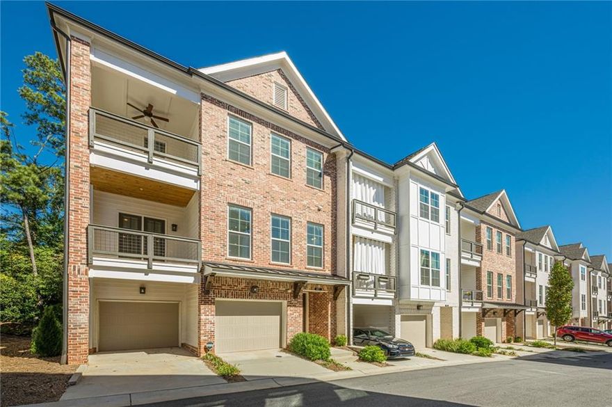 A Like New 2515 Square townhome in Alpharetta. Experience a new level of luxury and convenience in this meticulously designed end-unit brownstone. From the moment you step inside, you'll be greeted by an open-concept layout spanning three spacious stories. The heart of the home is the chef's kitchen, featuring stunning Cambria countertops, upgraded tile back-splash and a large central island. This area flows seamlessly into the family room making the space perfect for both daily living and entertaining. The living area boasts wooden beams accenting the ceiling and a shiplap fireplace with wooden mantle. Retreat to the expansive owner's suite, a private sanctuary complete with a luxurious en-suite bathroom, a free-standing tub, and its own private deck. The shower is a dream with a regular shower head, handheld sprayer and rainwater faucet overhead. The luxurious soaking tub includes a hand held sprayer as well. The primary bedroom's generously sized walk-in closet is a dream come true, offering custom shelving and drawers to keep your wardrobe perfectly organized. With four bedrooms and three-and-a-half bathrooms, there's lots of space for family and guests. Full terrace level with large bedroom, full bath and extra storage. Complete with terrace level private back patio. Complete with a 2 car garage with overhead storage. This home offers plenty of options for outdoor relaxation with not one, but three covered decks, a terrace patio and a cozy fenced backyard area. Modern living is made easy with seamless Alexa smart home capabilities integrated throughout as well a complete security system. Take advantage of fantastic community amenities, spend your days relaxing at the pool and cabana, playing bocce ball, or gathering around the fire pit with neighbors. Located in a lively mixed-use development, you'll be steps away from the Maxwell's retail which includes Fairway Social for entertainment, and one of the best Thai, Sushi and Seafood Restaurants in the area...all steps away. For both keeping active and connectivity there is the Alpha Loop, leading to downtown Alpharetta and the Avalon, with an array of dining, entertainment and shopping options at your fingertips.  This is more than a home—it's a lifestyle. Living at The Maxwell means you can leave the car at home and truly enjoy everything Alpharetta has to offer. If there's a "best places to live," "best places to raise a family," or "best community" list somewhere, there's every likelihood Alpharetta is on that list. Alpharetta is one of the most desirable places to live in Georgia and the nation. Come view this amazing townhome, it's what you've been looking for!