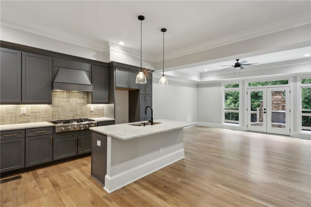 Welcome to Mystic Ridge—this fully renovated tri-level townhome in gated Sandy Springs is move-in ready and never lived in since the complete renovation. Light-filled interiors feature brand-new hardwood flooring, custom built-ins, coffered ceilings, and an open-concept layout perfect for entertaining. The chef’s kitchen includes gray shaker cabinets, a 6-burner gas range, premium stainless steel appliances, a large center island, and designer lighting. French doors open to a private deck with an outdoor fireplace. The spacious living room features a sleek gas fireplace flanked by custom shelving. Upstairs, the primary suite impresses with a spa-like bath and oversized shower. Terrace level includes media room/flex space and full bath. 2-car garage. Walkable to Sprouts, Kroger, Restaurant Row and minutes to Chastain Park, GA-400 & I-285.
Live minutes from the best of Sandy Springs and Buckhead in this pristine, move-in-ready home.