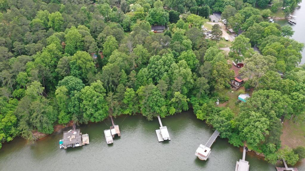 16.38 acres. Over 2800 feet of lake front. Multiple home sites possible mixed use. Current zoning AR3. Rare opportunity to purchase this much land on the lake. Close to Holiday Marina/ Margaritaville. 777' northern facing lake frontage. 1350' Peninsula East facing lake frontage. Property to the North of Buford Waterworks. Distant/ Direct view of Holiday Marina, University Yacht Club & Burton Mill Park.