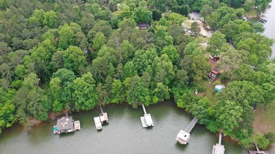 16.38 acres. Over 2800 feet of lake front. Multiple home sites possible mixed use. Current zoning AR3. Rare opportunity to purchase this much land on the lake. Close to Holiday Marina/ Margaritaville. 777' northern facing lake frontage. 1350' Peninsula East facing lake frontage. Property to the North of Buford Waterworks. Distant/ Direct view of Holiday Marina, University Yacht Club & Burton Mill Park.