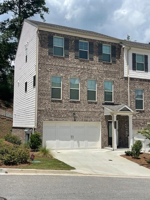 Stunning, like new, three story end-unit townhome in the new community of Hamlin Grove. Private end-unit with view of landscaped hillside. Lower level includes a two car garage, main entrance to unit and a guest/home office with private bath. The beautiful main level boasts a gorgeous kitchen with white cabinetry and SS appliances. Room for kitchen table or just additional open space. Family room includes two additional windows flanking the amazing fireplace with new TV mounted over the mantle. Half bath on main level. Upstairs boasts an oversized primary suite with tray ceiling and a beautiful view of the private back area of the property. Spacious ensuite and closet space. A hall laundry closet with washer and dryer between the primary suite and secondary guest room. Enjoy the private back area of the property on the secluded back deck.