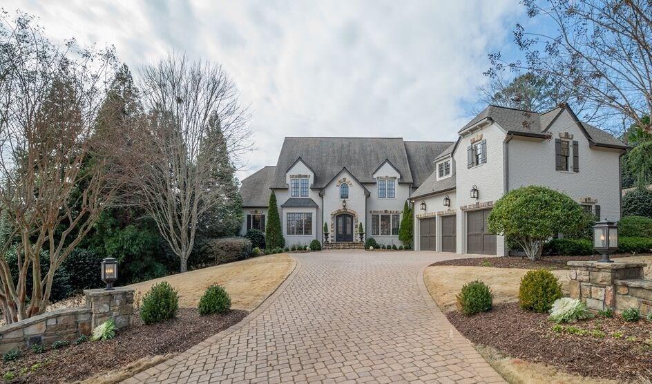 GREAT PRICE IMPROVEMENT! luxury brick estate in the most desirable location of East Cobb overlooking Chattahoochee River. Outstanding RayMac remodel with great attention to detail inside and out. Master suite boasts marble bath, fireplace and a sitting room that opens to a private porch overlooking the picturesque valley. Gourmet kitchen, home theatre, fireside study, gym & sauna, wine cellar, bar & tasting room are some of what make this one a show stopper! 3 car garage, stone driveway, great space for a pool. Smart home automation system. Walton High. Cobb Co taxes.