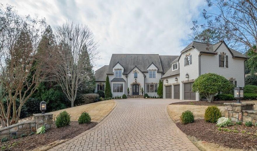 GREAT PRICE IMPROVEMENT! luxury brick estate in the most desirable location of East Cobb overlooking Chattahoochee River. Outstanding RayMac remodel with great attention to detail inside and out. Master suite boasts marble bath, fireplace and a sitting room that opens to a private porch overlooking the picturesque valley. Gourmet kitchen, home theatre, fireside study, gym & sauna, wine cellar, bar & tasting room are some of what make this one a show stopper! 3 car garage, stone driveway, great space for a pool.  Smart home automation system.  Walton High. Cobb Co taxes.