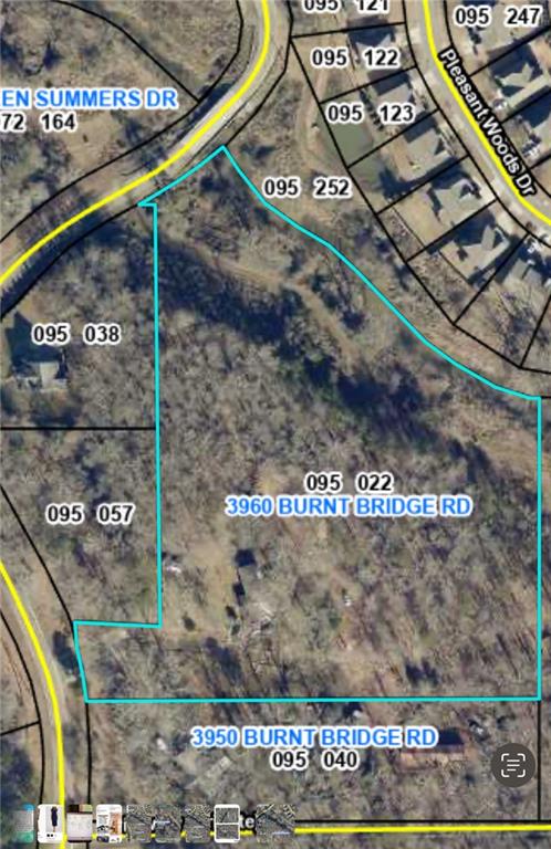 North Forsyth 14.16+/- acres wooded acreage just off Burnt Bridge Rd. Great location to the new Matt Town Center. This land has approx. 98 ft of road frontage and county states Both parcels listed have sewer located within the parcel boundaries. They would have access to sewer without the need for a sewer easement. See docs for plat, parcel and county info.
