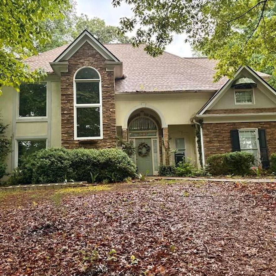 NEW PICTURES!   Bring the horses!  Location is key.  Great schools, no HOA, 2 acres, and more. The house sits on prime 2 acres with beautiful trees and has a great floor plan. The master suite is on the main, there is a half bath on the main for guest and upstairs are 3 more bedrooms with 2 bathrooms.  Behind the house is a one bedroom/one bath apartment complete with a kitchen for guests, rental, family or office space.  It has multiple ways to be used depending on what is going on with your life.  Across the street  there is a Wild Mustang Rescue ranch. This property is protected and will be home to Wild Mustangs forever.     Both house and apartment are lived in and will need a 48 hour notice before showing.   Plus, there are dogs to get out of the house.