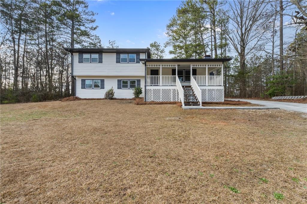 Stunningly renovated 5 bed/3 bath home featuring brand new Luxury Vinyl Plank flooring throughout, new interior and exterior paint, new lighting and plumbing fixtures everywhere, new granite countertops in kitchen and bathrooms, and new stainless-steel appliances. Wonderful curb appeal with covered front porch and brand new concrete driveway. Bright living room offers large windows, fireplace, and views to the kitchen. Kitchen provides new granite, stainless steel appliances, eat-in kitchen, island with overhang perfect for barstools, and access to the screened in back deck. Upstairs the Master Bedroom offers an En-suite with low flow toilet, new granite, and walk in shower. Two secondary bedrooms and secondary bathroom with new granite, low flow toilet, and tub/shower combo. In the basement you will find a large room perfect for a second living room or den and two additional bedrooms with full bathroom with walk in shower. Basement also provides a separate washer and dryer connection and separate entrance making it perfect for an apartment/in law suite! Out back the screened in deck overlooks the gazebo and large back yard waiting for your personal touch.