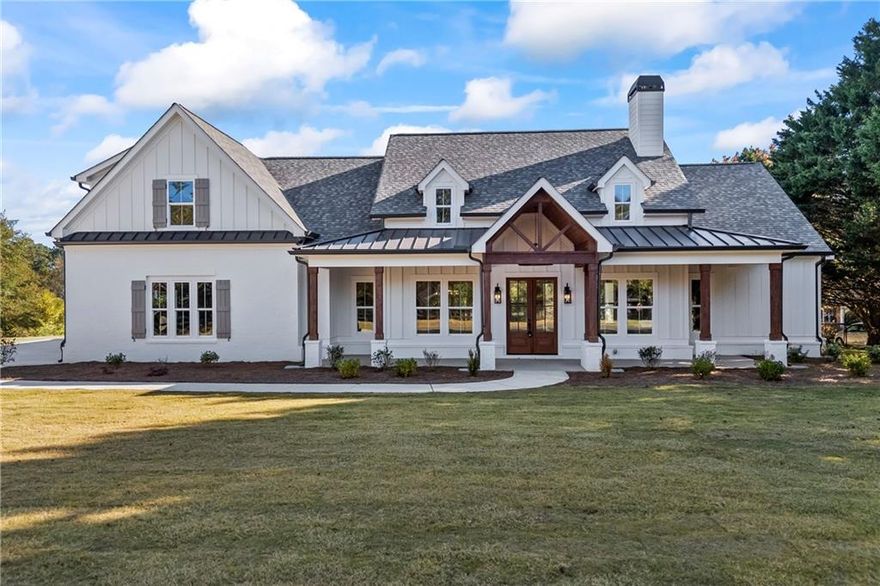 The Ethan - Move-In Ready! New Construction.  A Modern Farmhouse Newly Constructed in Monroe, GA nestled on 2.52 Acres. Enter the Home from the Covered Front Porch and Portico, through the Double Doors to Hardwood Floors Throughout and a Large Family Room with Vaulted Ceilings and Exposed Wooden Beams. The Dramatic Stacked Stone Fireplace has a Reclaimed Mantle and Custom Built-In Shelving. The Split Bedroom Plan Features a Master on Main with Exposed Beams; Master Bath with His & Hers Vanities, Spa-Like Marble Shower, Free Standing Tub, & Walk In Custom Closet; Convenient floor plan with Two Large Secondary Bedrooms with Jack & Jill Bath Plus, 1 Bonus Room/Flex Room Up or 4th Bedroom & 1 Full Bath Up; Bright White Gourmet Kitchen Features Large, Beautiful Stained Wood Accent Island with all White Kitchen Cabinets, Farmhouse Apron Sink, Pot Filler, Wood Vent Hood, Stainless Appliances, & Subway Tile Backsplash; Dining Area and Walk In Pantry; There is a mudroom area off of the garage with hooks and cubbies for convenience. The Large Laundry Room features herringbone brick flooring, cabinets, and opens to the custom master closet leading to spa-like bath. Double doors in Family Room lead to the Rear Covered Porch - An Entertainer's Dream with Vaulted Ceiling with Wood Accents, Overlooking Private Acreage! Exterior Details include White Brick, Wooden Accents & Black Metal Overhang, Extensive Landscaping, 2-Car Attached Garage and No HOA . Home is Complete and Move-In Ready. **Plan subject to change** Ask about Builder Incentive!