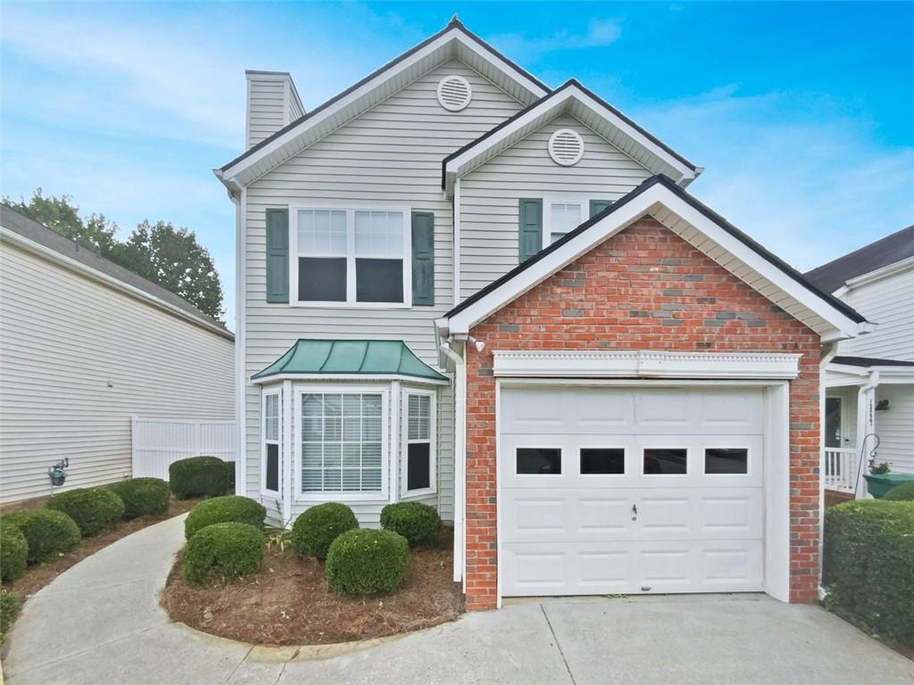 Fantastic opportunity to live in a great Alpharetta swim/tennis community! This home has great curb appeal with brick accents and clean landscaping. Inside has a great layout with no wasted space. There is a large great room with cozy fireplace, separate dining room, and a kitchen with timeless white cabinets, breakfast bar, stainless steel appliances, and granite countertops. Upstairs has 2 large bedrooms and 2 full bathrooms. This would be a great roommate plan! There is a patio in the back perfect for outdoor grilling and it overlooks the fenced back yard which would be great for pets, children, or gardening. This is a perfect package!
