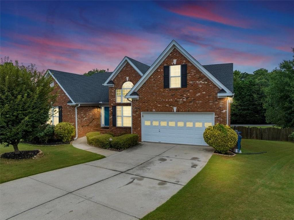 Don’t miss this exceptional opportunity to own a beautifully renovated, move-in ready, brick-front stepless ranch home located in a quiet cul-de-sac within the highly rated Archer High School District in Gwinnett County! This spacious 4-bedroom, 2-bathroom home sits on a large private lot and features a full, unfinished basement with unlimited potential for future expansion or customization. Inside, you’ll be welcomed by a wide foyer and an elegant separate dining room, all enhanced by high ceilings and abundant natural light. The stunning chef-style kitchen has been fully updated with premium Quartz countertops, an abundance of cabinetry, designer backsplash, and overlooks the family room with a cozy fireplace and custom accent wall. An open keeping room provides extra space for relaxing or entertaining. The owner’s suite is privately tucked away at the back of the home and offers a large walk-in closet, spa-like bathroom with double vanities, tiled walk-in shower, and a tub. Three additional bedrooms are located on the opposite side of the home and share a beautifully upgraded full bath. Additional upgrades include new luxury vinyl flooring throughout, fresh interior paint, and a newly painted deck overlooking the fenced-in backyard, perfect for outdoor enjoyment. Nestled off Sugarloaf Parkway, this home offers convenient access to I-85, GA-316, Sugarloaf Mills, Gwinnett’s Gas South Arena, Hwy 124, and the vibrant Historic Downtown Lawrenceville. Qualifying buyers may benefit from 100% financing and up to 5% down payment assistance funds when using our preferred lender. This move-in ready gem offers comfort, style, and room to grow—schedule your private showing today! ***OpenHouse on Saturday, July 26 from 1 to 3 pm***