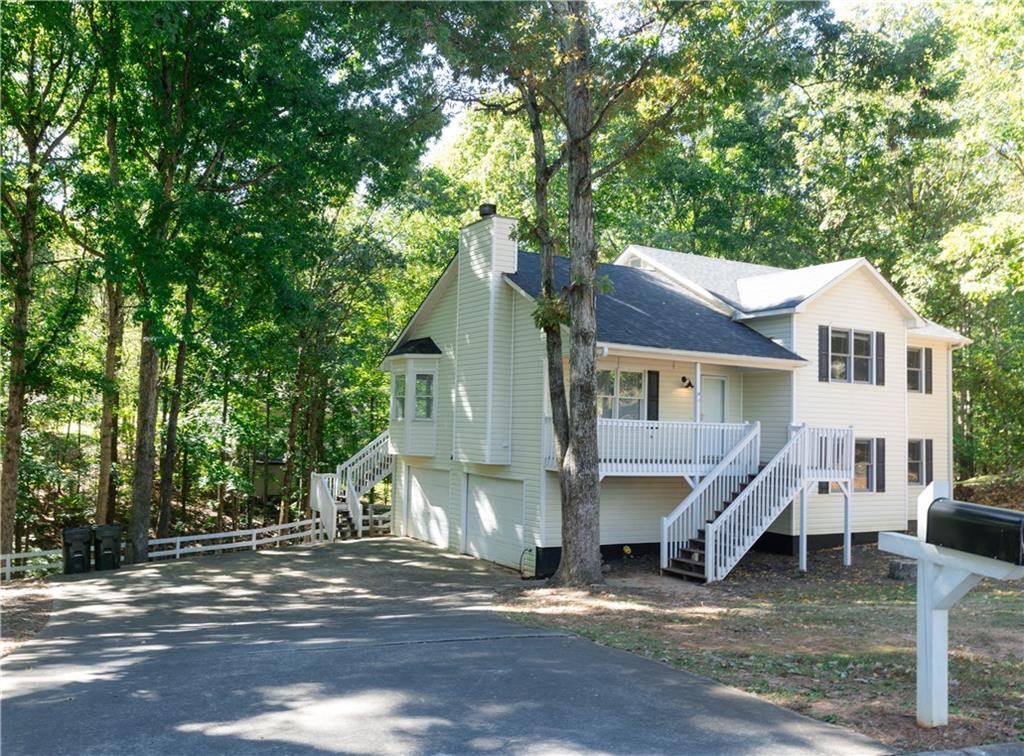 Gorgeous home located on a private cul-de-sac lot his 4 bedroom home is perfect for a growing family! Walk into the family room with a cozy fireplace, open to kitchen spacious kitchen featuring white cabinets, island and breakfast area. The primary bedroom features trey ceilings, walk in closets, and full bathroom with a double vanity, garden tub and separate shower. Lower level has a second tv area/bonus room, bedroom. Enjoy and relax on the back deck that overlooks wooded backyard. The large driveway is great for storing multiple vehicles. Convenient to interstate, schools and more! **Professional Photos Coming 7/10/25**