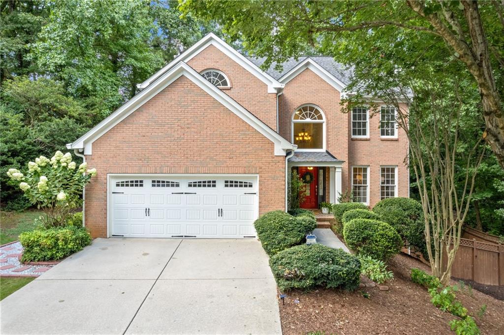 Looking for an affordable home in the award winning city of Johns Creek - look no further! This incredible 5 bedroom, 3 1/2 bath home is move in ready with space for the whole family. The main floor features a great layout with multiple living spaces, a formal dining room, powder room, laundry room and kitchen with breakfast room that leads out to the deck overlooking the great backyard. Upstairs you will find four bedrooms and two full baths. The finished terrace level has a fifth bedroom, full bath and rec space as well. This home has been updated with fresh paint and new hardwood floors. The backyard is private, peaceful and made for entertaining. Windermere Park is a quiet neighborhood with a community pool and playground and is districted to some of the top schools in the state. This convenient location is close to shops, restaurants and easy access to GA 400 yet feels tucked away - it's the best of both worlds!
